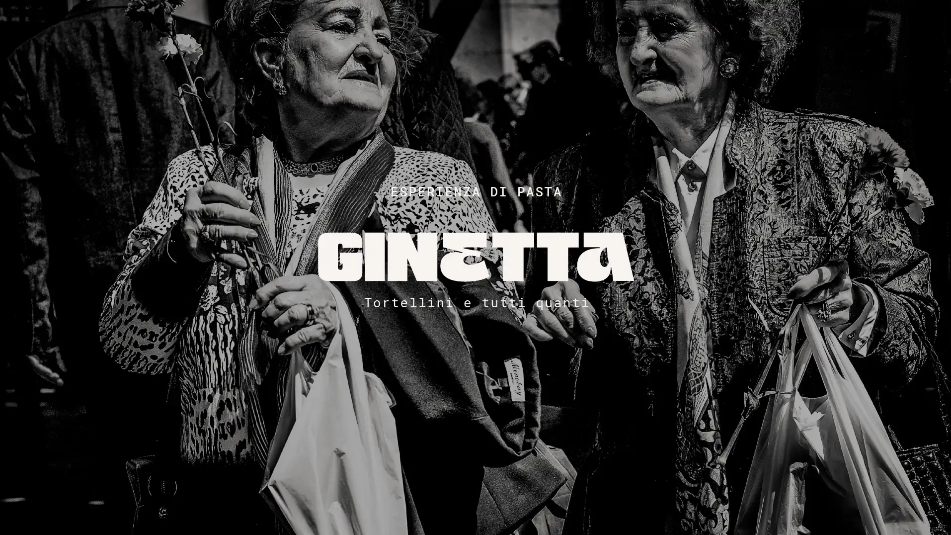 Black and white photo of two nonas with market bags and parasols under southern sun, Italian transmission and humor, "Esperienza di Pasta" text and Ginetta logo in white