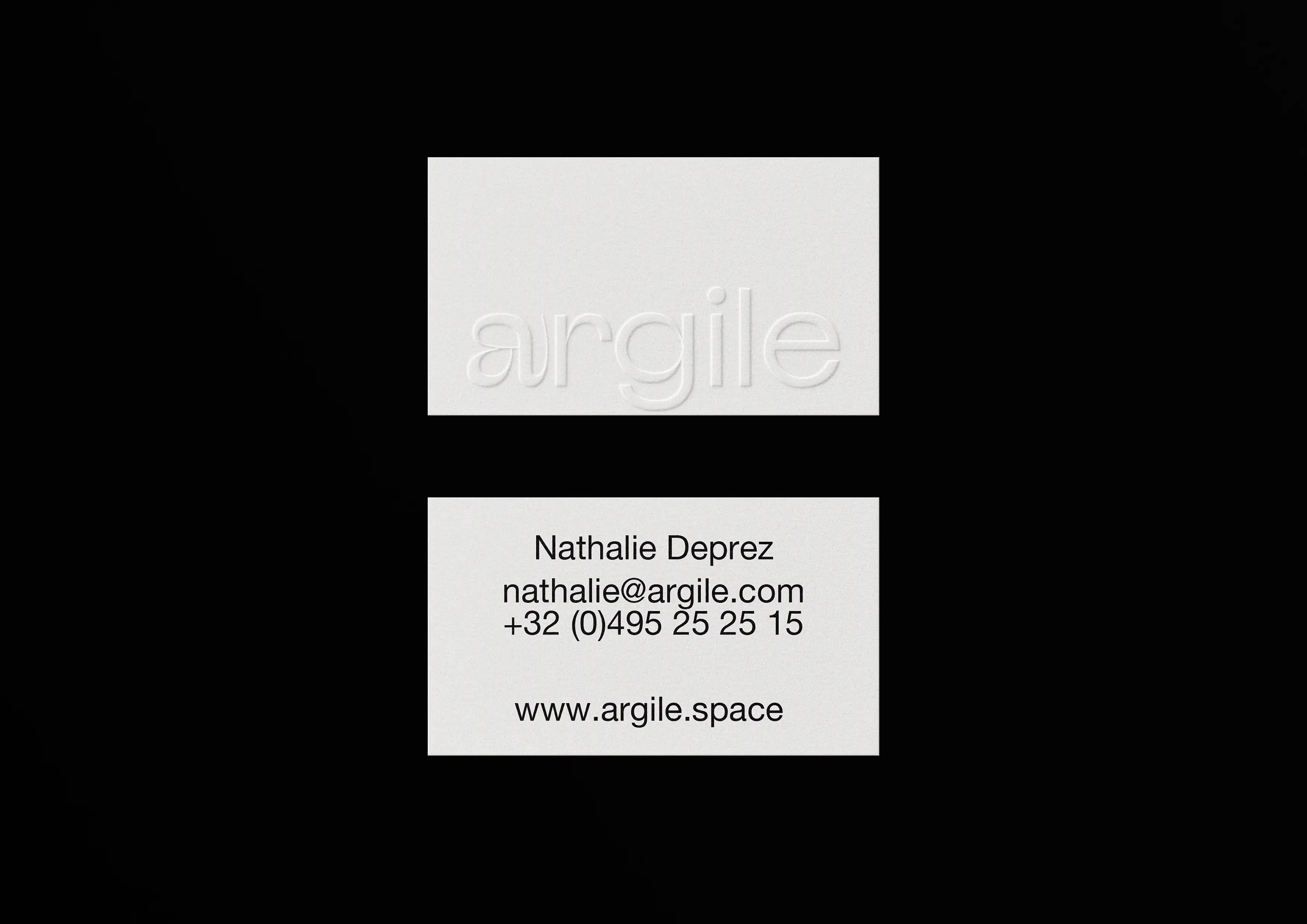 Minimalist cream Argile business card with raised logo, employee details verso, luxury cardstock on black background