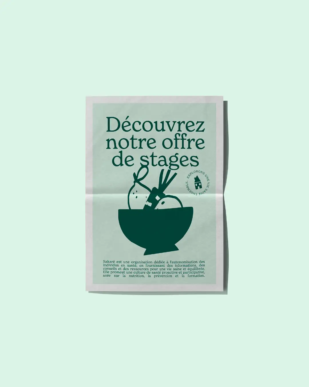 Sakare 02 Sakaré composition on light green background: folded newspaper cover with center crease, dark green editorial layout featuring "Discover our internship offer" headline, fruit basket illustration and body text footer