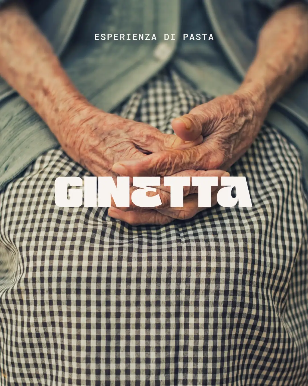 Emotional close-up of nona's weathered hands in gingham skirt and green cardigan, symbolizing Italian culinary transmission, "Esperienza di Pasta" text and Ginetta logo in white, Studio La Folie brand identity